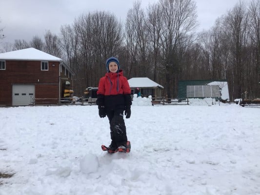 kid outside snowshoeing